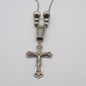 Vintage Material Crucifix necklace with mixed metals.